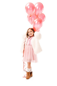穿着时尚衣服的快乐小孩子，白色的空气气球被隔离了
