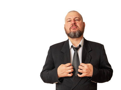 可敬的人以傲慢的目光展示了他的优越感,并用手拿着他的夹克.照片