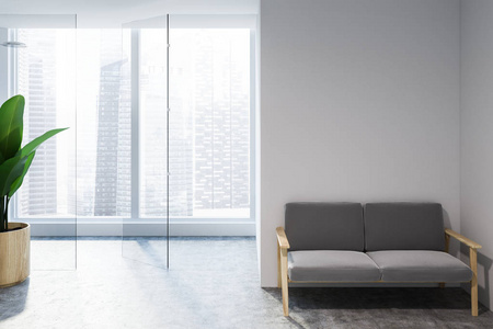 极简主义客厅内部有白色墙壁，混凝土地板，小灰色沙发靠近墙壁和全景窗。 3D渲染