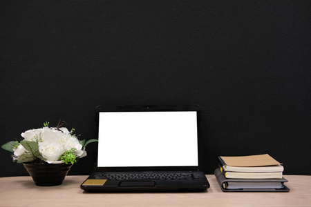  flower in flowerpot on  workplace desk. business workspac