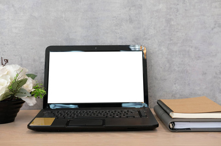  flower in flowerpot on  workplace desk. business workspac