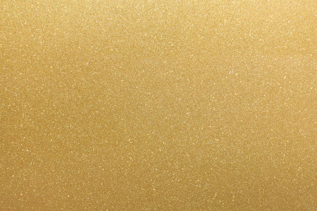 金色抽象闪光橙黄色平坦的表面与闪烁的白色不规则斑点.