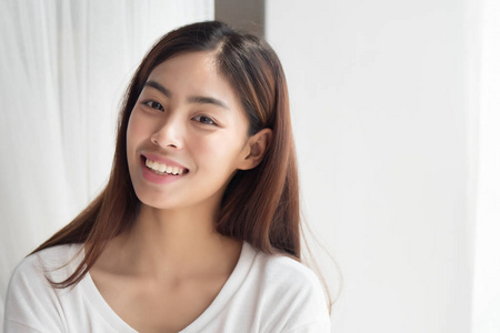  portrait of positive relaxed happy smiling asian woman smiles i