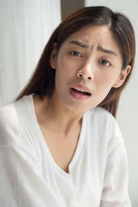  furstrated and surprised asian woman showing questioning face e