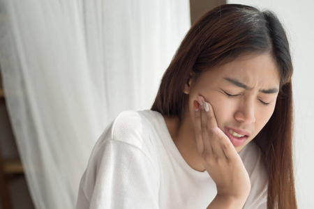  portrait of woman suffering from toothache pain, tooth decay, t