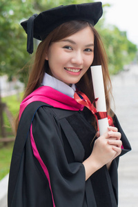  portrait of diploma or college woman student with graduation de