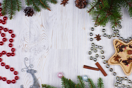 s frame with a deer, glittering beads and decorated fir branches