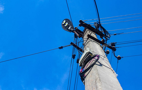 Electricity post in blue sky. Outdoor view. Electrical powered p