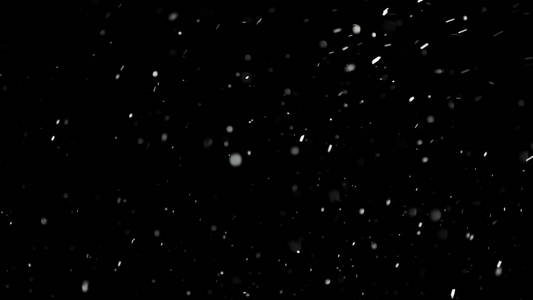 白雪落在孤立的黑色背景