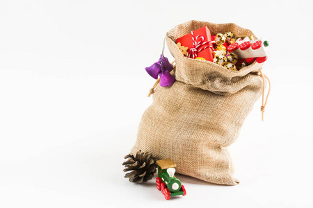 s bag with various presents on white background with copy space