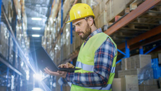 s Standing in the Middle of  a Big Distribution Center with Big 