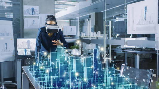 高科技办公室使用虚拟现实建模软件应用.照片