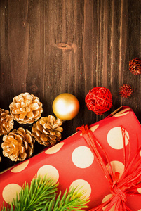 s Day festive decoration, golden and red balls, golden fir cones