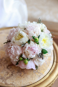 s hand of white peonies