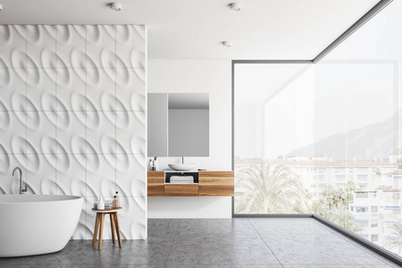 现代浴室的内部有几何图案的墙壁，混凝土地板，全景窗，白色浴缸和白色水槽站在木制柜台上。3D渲染