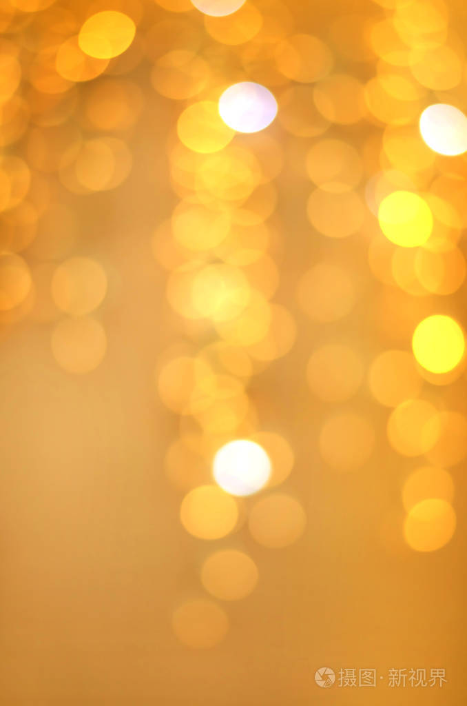 金色的变形背景与节日明亮的灯光