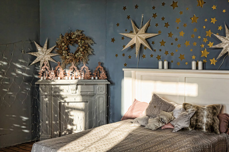 s interior. Bedroom with fireplace decorated with Christmas star