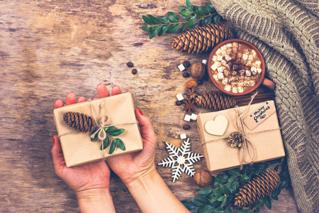 s hand holds a cup. Winter, New Year, Christmas still life. 