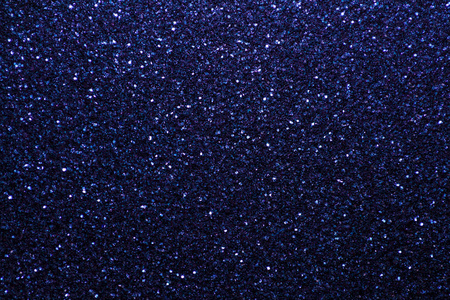 海军蓝闪闪发光的背景从小亮片特写. 来自纺织品的明亮闪亮的背景.