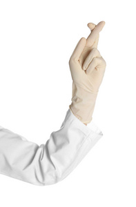 戴着医用手套的医生手指在白色背景下交叉