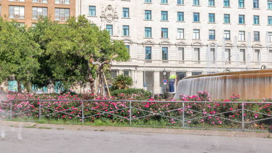 s considered to be the city centre. Fountain and flowerbed on ba