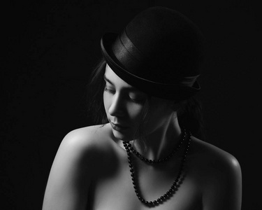 s portrait in a black hat