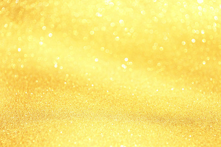 金光闪闪,有波克效应和选择性聚焦. 节日背景与明亮的金灯香槟泡沫.
