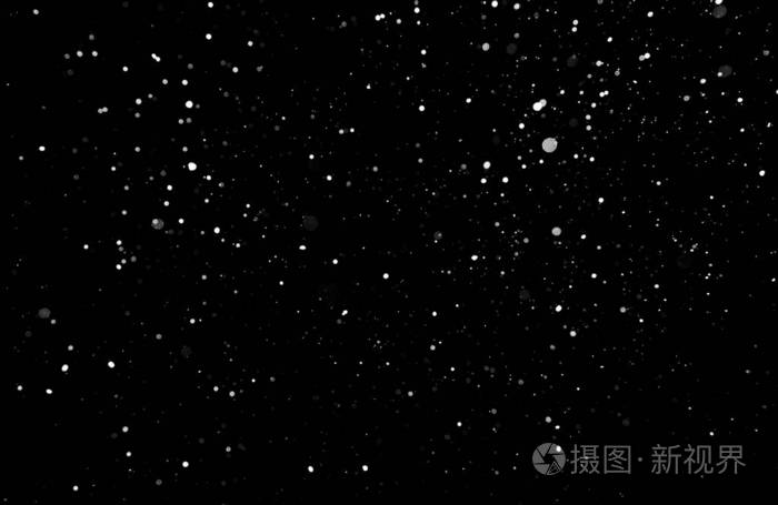 暴风雪的质地. 黑色背景下的灯光,天空中飞舞的雪花