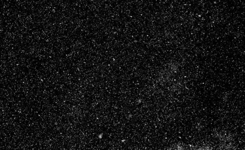 雪星白点在黑色背景下旋转照片