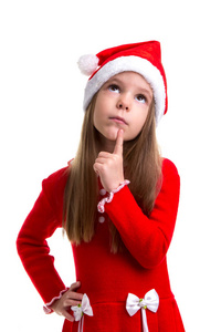 梦幻般的圣诞女孩戴着一顶圣诞老人的帽子, 在白色背景中被孤立