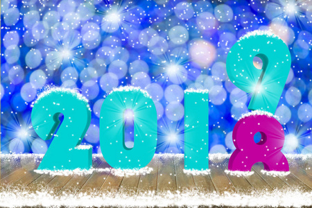 2019年的文字，木桌顶部与雪和装饰轻背景