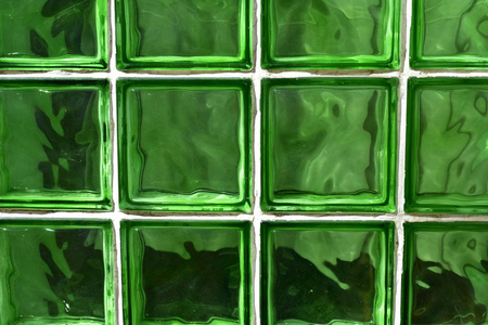 绿色玻璃砖背景。 绿色玻璃纹理。 白色线条。