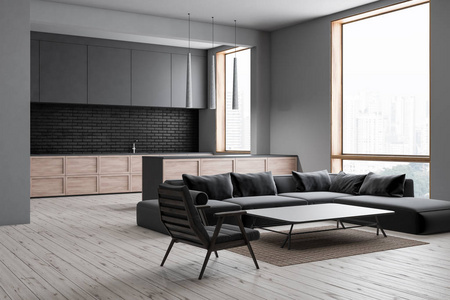 现代客厅的内部有灰色的墙壁，木地板，灰色的沙发和扶手椅，站在咖啡桌和厨房附近的背景。 3D渲染