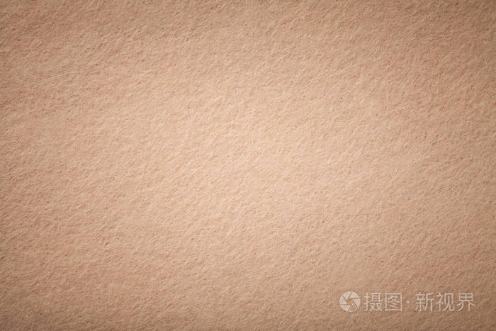 浅棕色哑光背景的绒面织物特写天鹅绒质地无缝米黄色羊毛毡与维内特