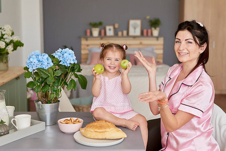 s day greeting card. Family mother and baby daughter in morning 