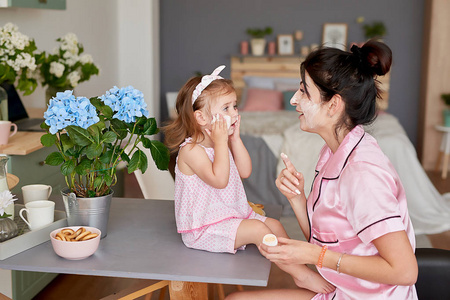 s day greeting card. Family mother and baby daughter in morning 