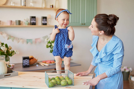 s day greeting card. Family mother and baby daughter in morning 