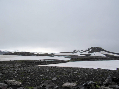 black landscape of Fimmvorduhals between glaciers Eyjafjallajoku