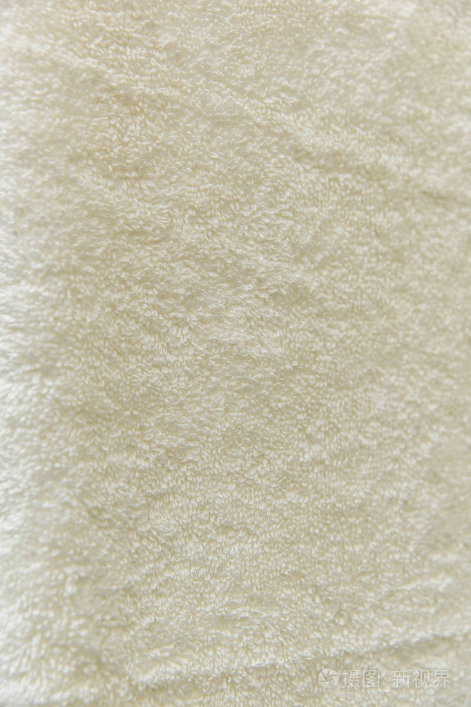 纹理背景特里毛巾. 奶油毛巾. 头发里有白色毛巾. 浴室用柔软的布料.