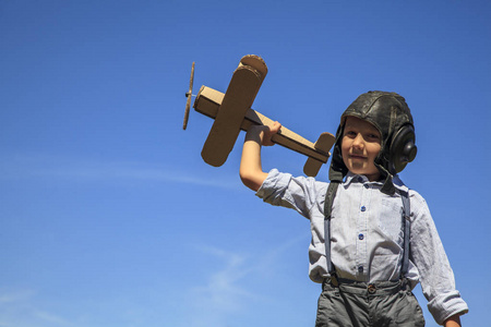  Happy child In a helmet with glasses and binoculars, playing wi