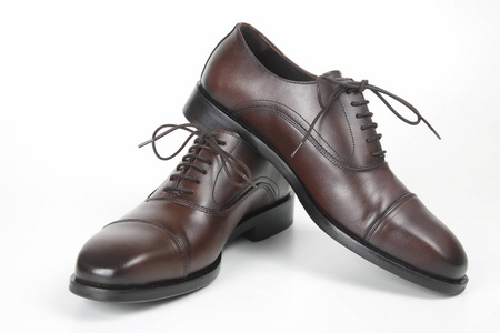 s brown Oxford shoes on white background. Leather shoes