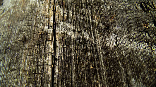 抽象的木材纹理。 旧裂缝木制背景