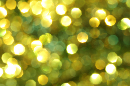 圣诞节抽象黄金背景与浅色模糊设计在您的工作新年概念。