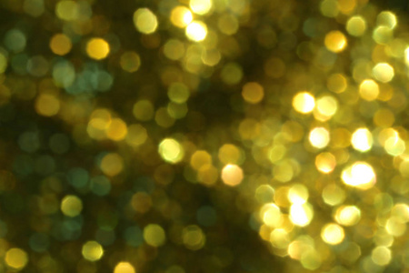 圣诞节抽象黄金背景与浅色模糊设计在您的工作新年概念。