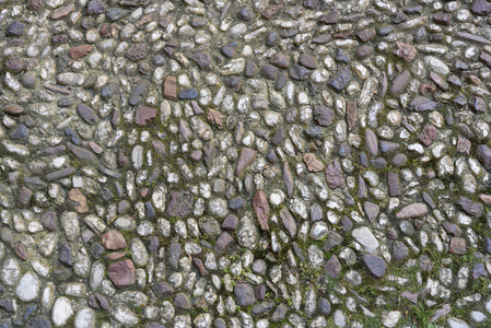海洋卵石。 小石砾质地背景。卵石层。彩色石头背景。