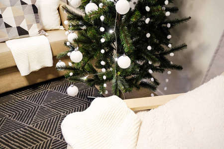 s interior. A small artificial Christmas tree with toys and cand