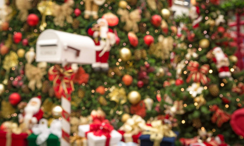 s mailbox with Christmas tree and gifts in blurred background