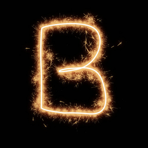 字母b的字母表，由Squib火花在黑色背景上写。