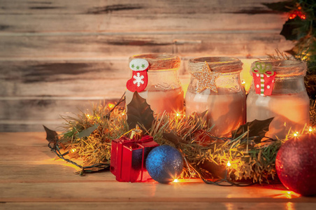 s composition with garlands. The wooden background is blurred.