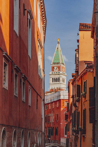 s Bell Tower between venetian architecture in Venice, Italy